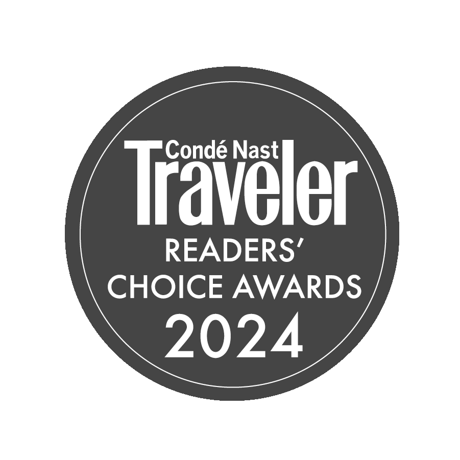 Image of a circular badge with "Condé Nast Traveler Readers' Choice Awards 2024" text on it.
