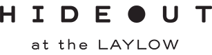 The image contains the text "HIDEOUT at the LAYLOW," with a stylized "O" containing a dot.